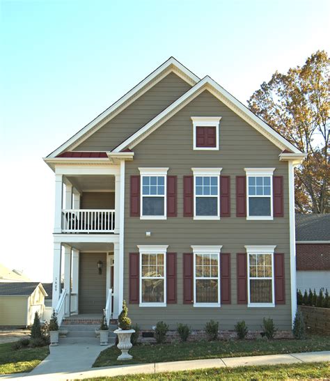 taupe house with metal hipp roof|Guide to Metal Roof Styles: Colors, Paint, and Accents.